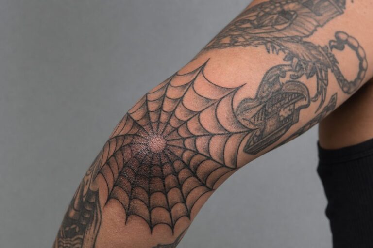 Spider Web Elbow Tattoo Meaning: Origins & Modern Symbolism