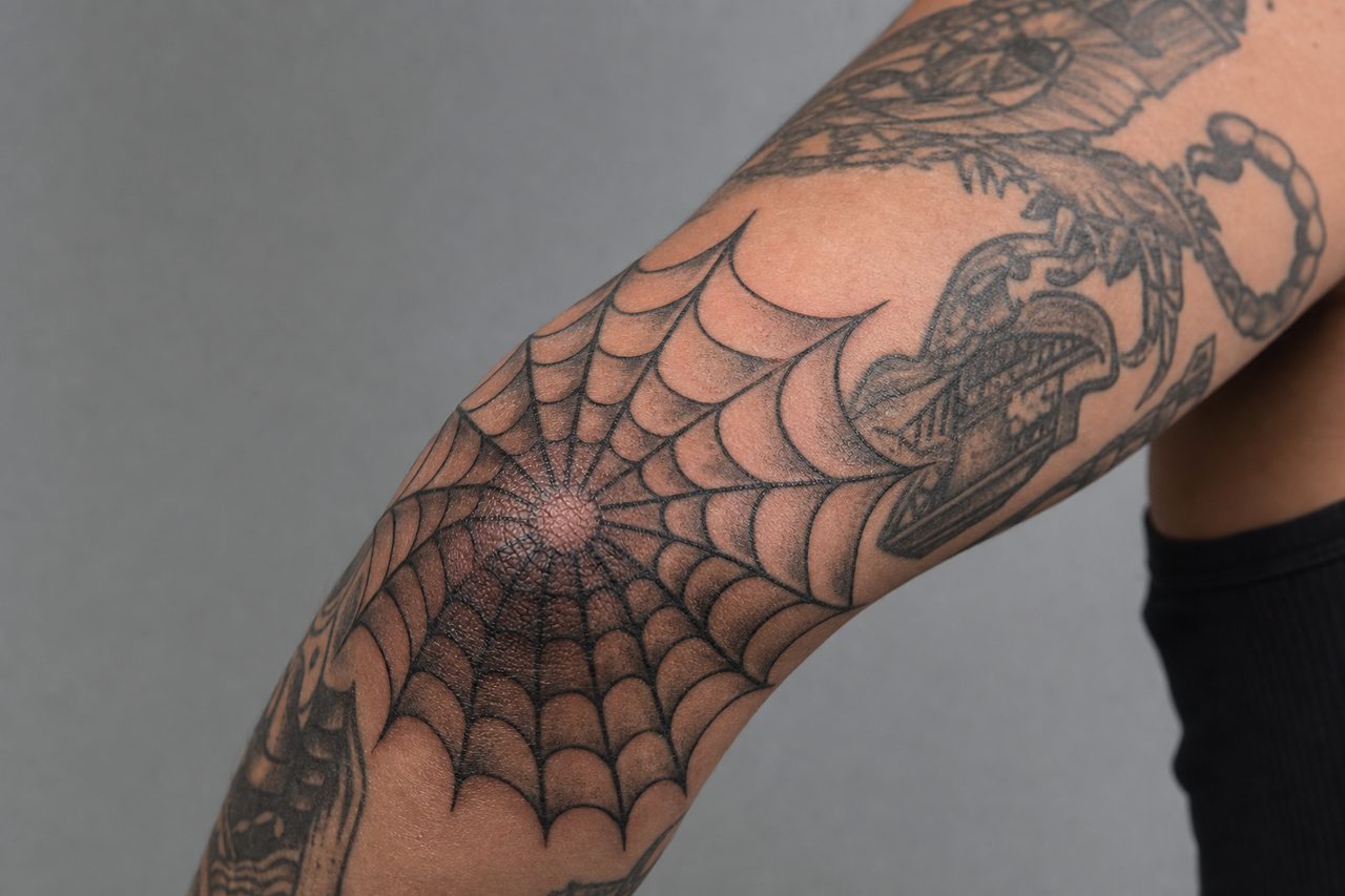 Spider Web Elbow Tattoo Meaning: Origins & Modern Symbolism