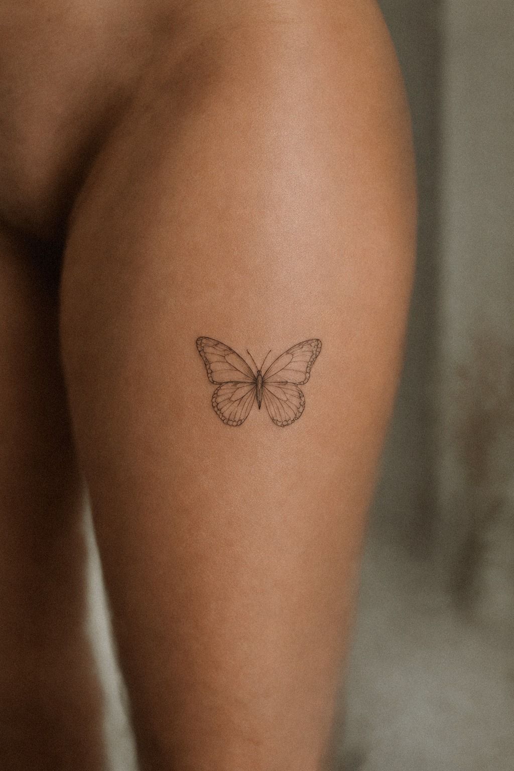 Delicate Small Butterfly Tattoo on the Wrist