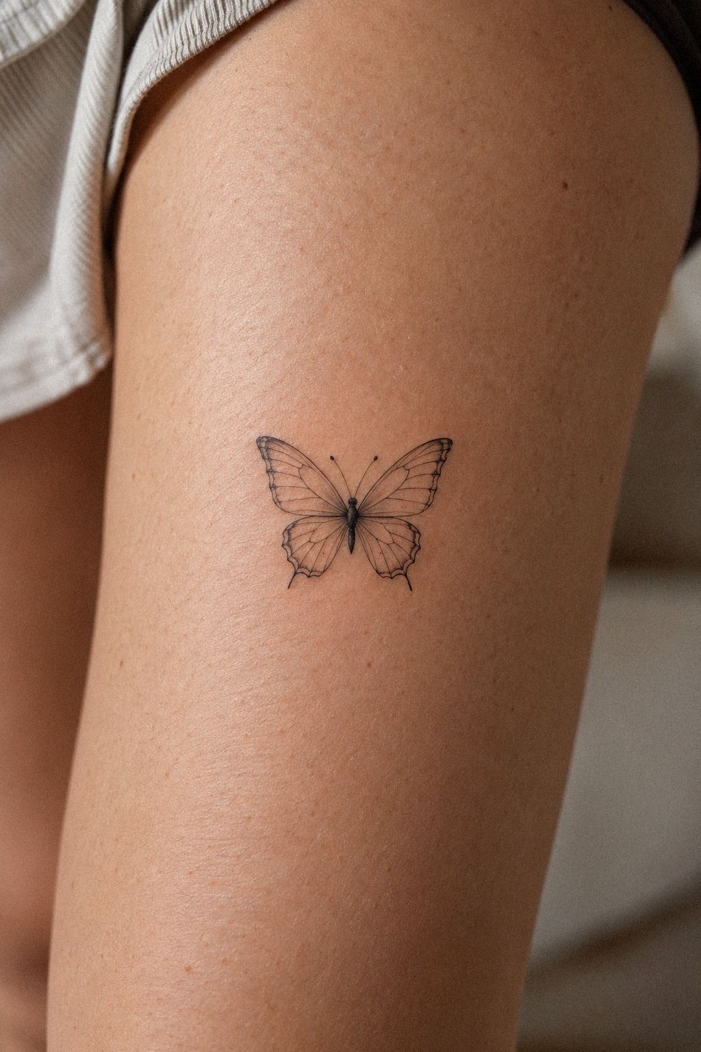 Delicate Small Butterfly Tattoo on the Ankle