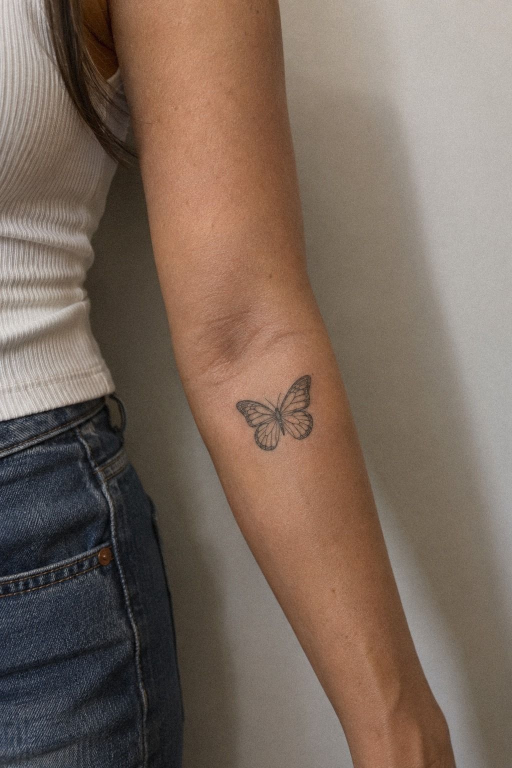 Position A Flowing Butterfly Near Your Elbow